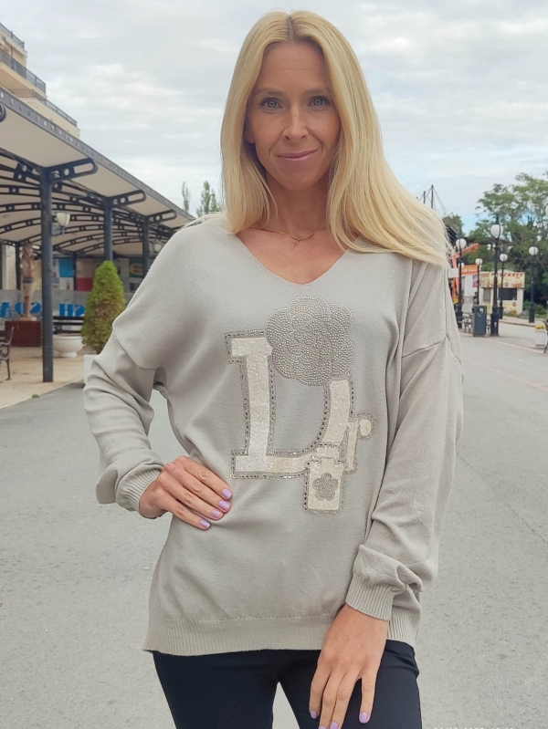 Women's sweater with V-neck and decorative accent