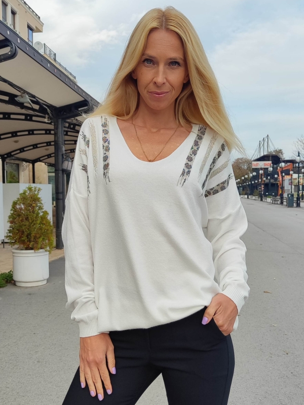 Women's blouse with V-neck and decorative accents