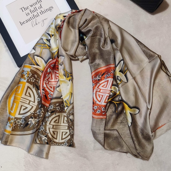 Large beige silk and viscose scarf with orange medallions and white flowers, a luxurious accessory for women