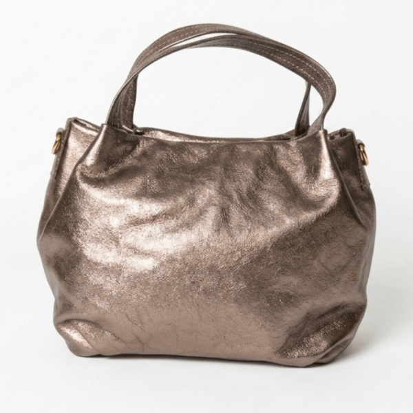 Elegant golden handbag made of genuine leather, front part