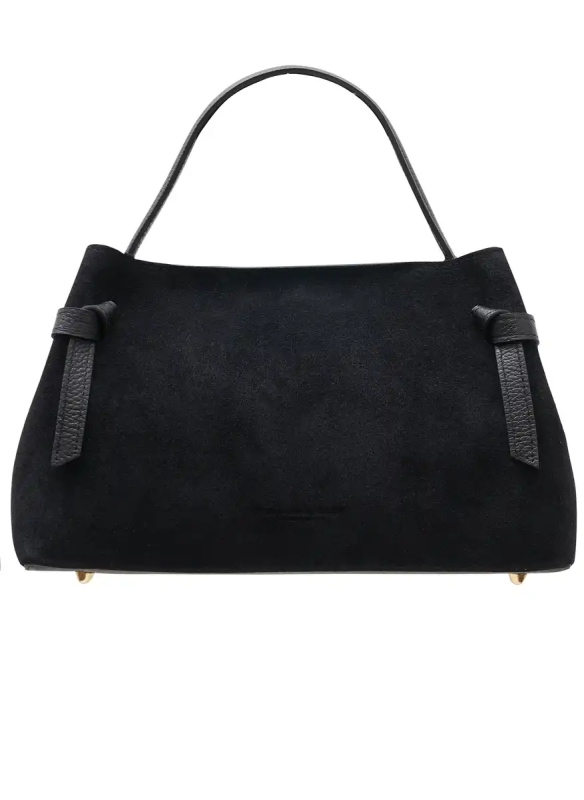 Elegant black bag made of natural suede with a trapezoidal shape, decorative leather knots and a fine handle