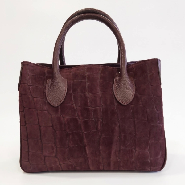 Front view of an elegant bag made of embossed suede and smooth leather in a wine shade.