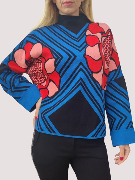 Women's sweater in blue with a flower.