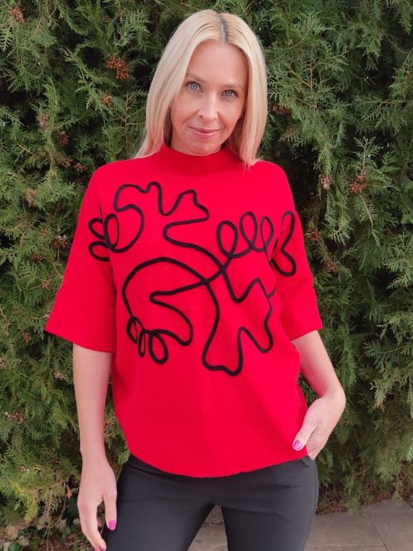 Red women's sweater with short sleeves and abstract black applique, front view