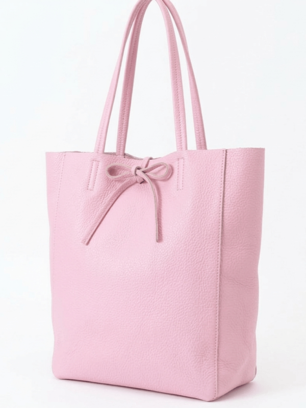 Light pink women's leather tote bag with ribbon and inner pocket