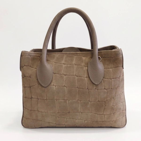 Front view of an elegant bag made of textured genuine suede and leather in a beige-taupe color.