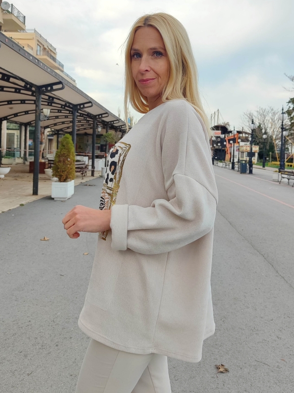 Women's beige sweater with animal print and gold accents - style and comfort