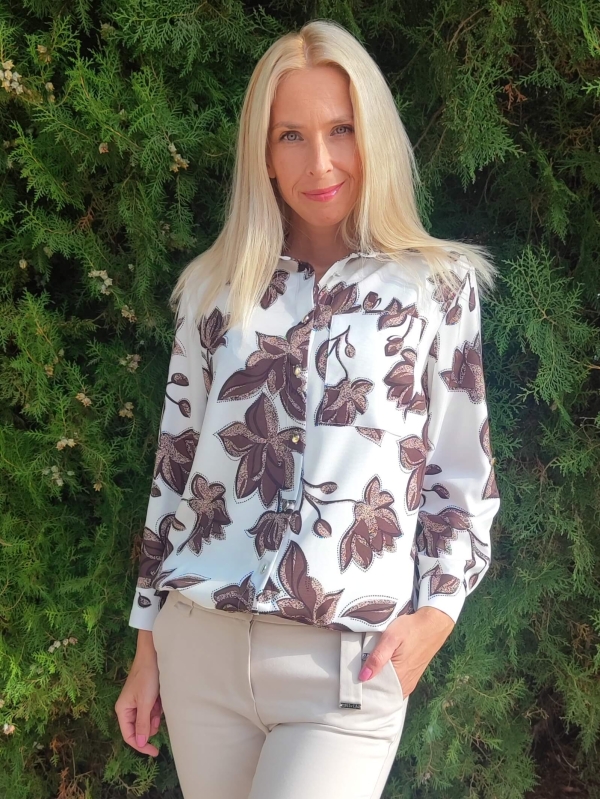 Elegant white women's shirt with brown floral motifs and a front pocket, made of viscose.