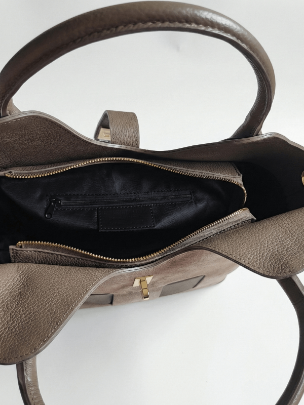Interior of the bag with one zipper compartment and one inner pocket