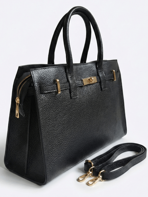 Black Vera Pelle genuine leather handbag - front view with a gold-tone clasp and short handles.