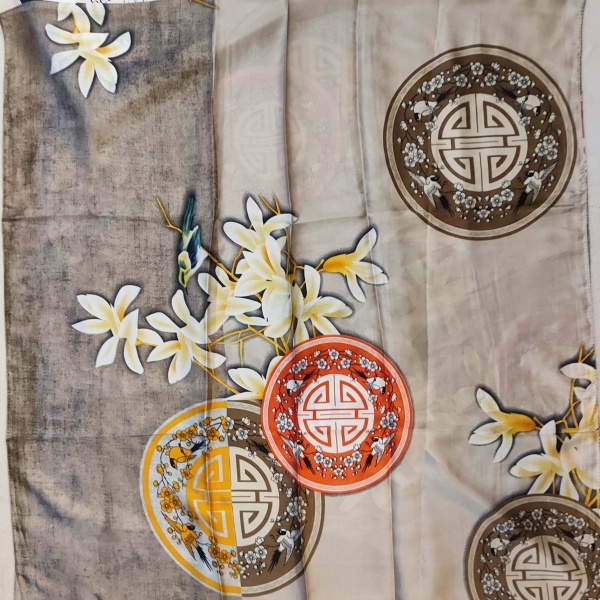 Large beige silk and viscose scarf with orange medallions and white flowers, a luxurious accessory for women