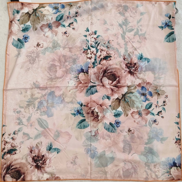 Detail of the fabric of a women's scarf with floral motifs