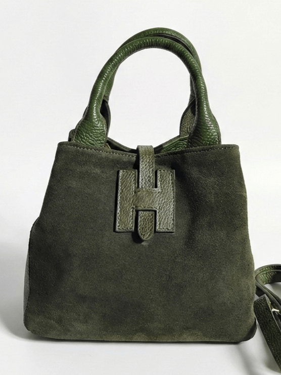 Green suede bag transformed into a compact trapezoid shape