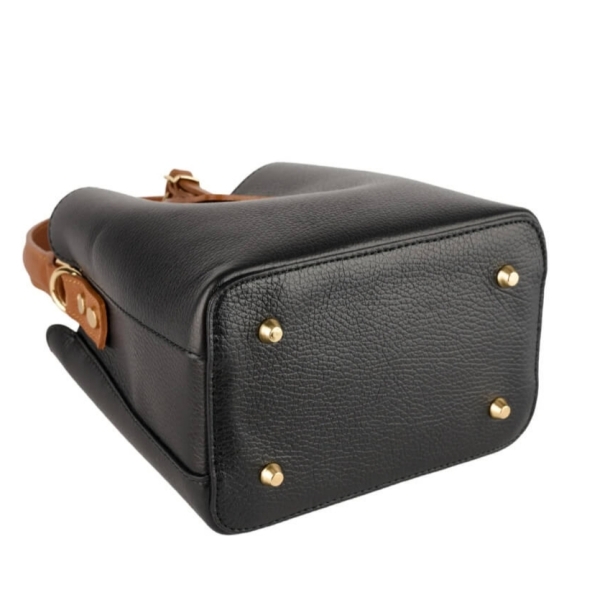 Metal feet on the bottom of a two-tone leather bag