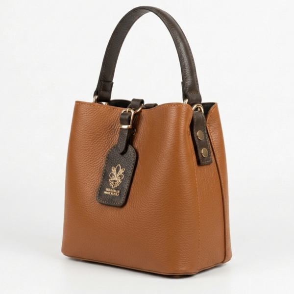 Elegant Italian handbag in cognac color with dark brown handle and leather logo, side view.