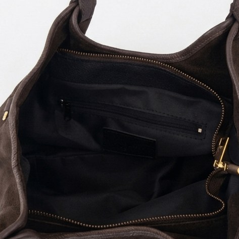 Interior compartment and lining of a brown leather bag Made in Italy