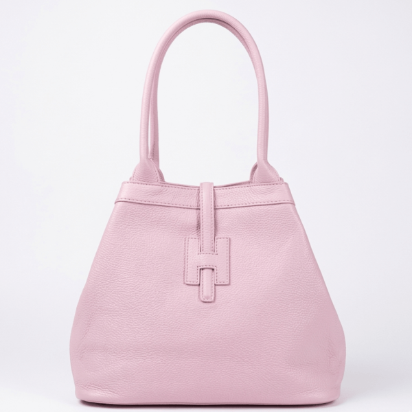 Pink handbag made of genuine leather, transformed into a compact trapezoidal shape.