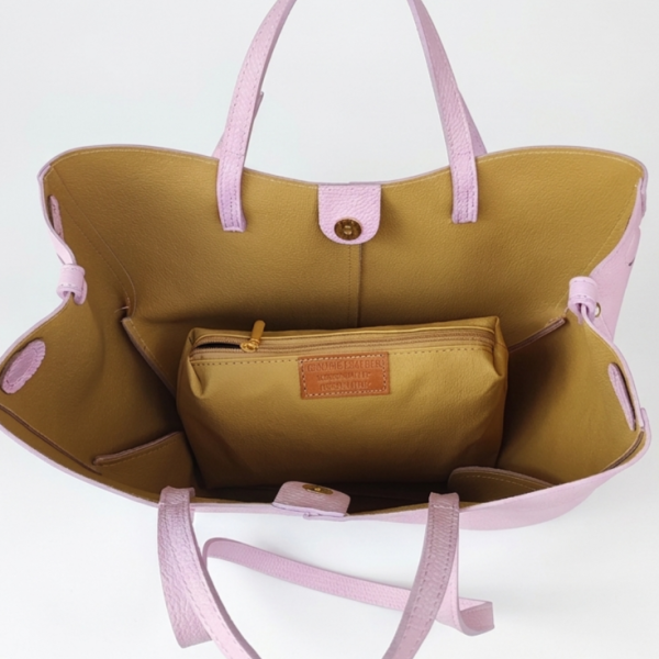 Large leather handbag with long shoulder strap and magnetic closure