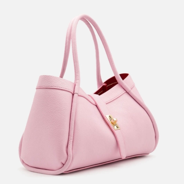 Stylish pink handbag made of genuine leather with a golden clasp