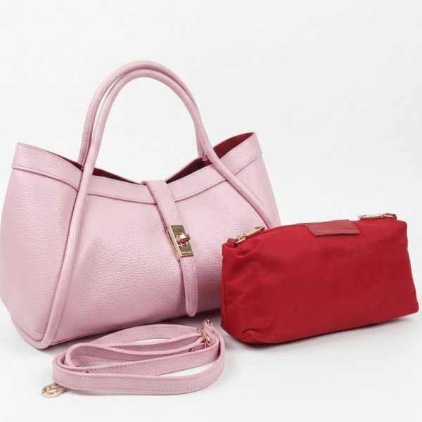 Stylish pink handbag made of genuine leather with a golden clasp