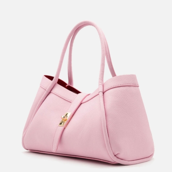 Stylish pink handbag made of genuine leather with a golden clasp