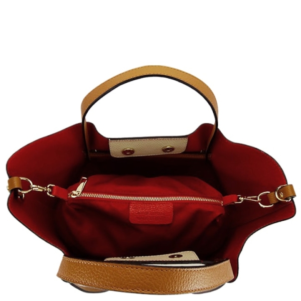 Interior of a red handbag with magnetic closure, genuine leather
