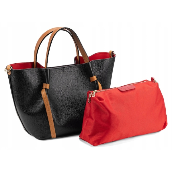 Interior of a red handbag with magnetic closure, genuine leather