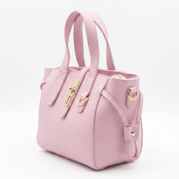 view of a baby pink leather bag with a gold clasp and short handles