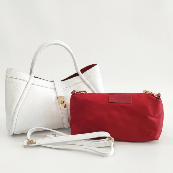 White genuine leather handbag with red toiletry bag and long shoulder strap