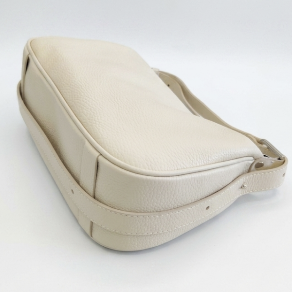 Bottom of a beige handbag made of genuine leather Unique Fashion