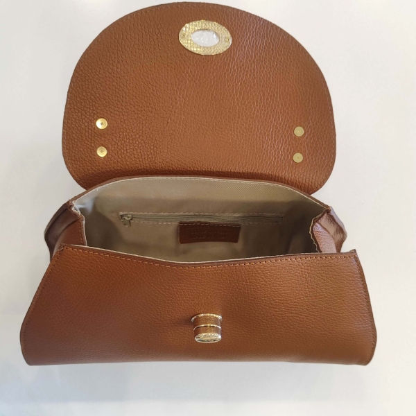 Interior of the Italian genuine leather bag, showing one main compartment and the inner zip pocket.