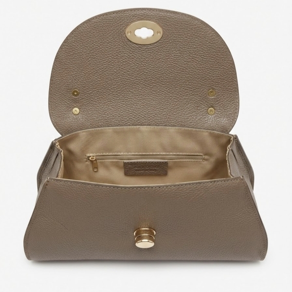 Interior of the open taupe Siena bag, revealing the light textile lining and the inner zip pocket.