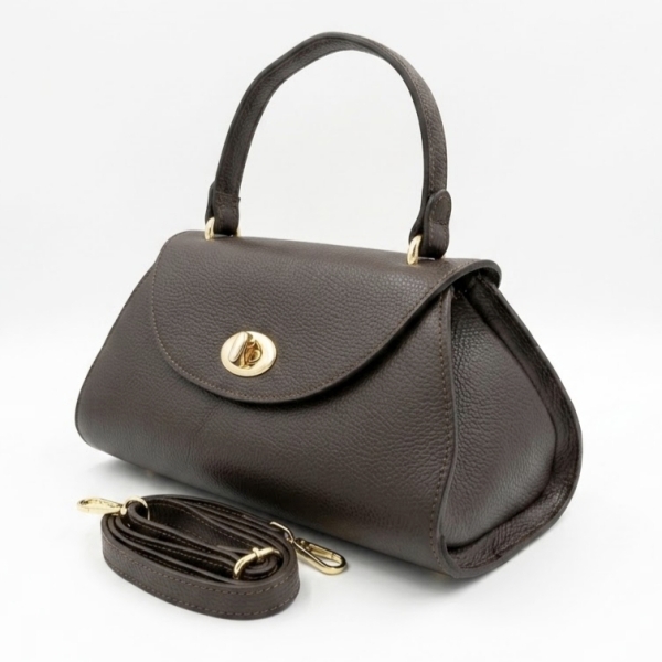 Side view of the chocolate brown leather Siena bag, showing the trapezoidal shape and rolled leather strap.