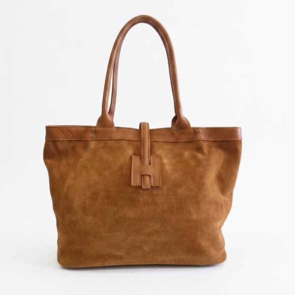 Large brown Italian handbag made of high-quality natural suede and leather, presented in a classic shopper shape.