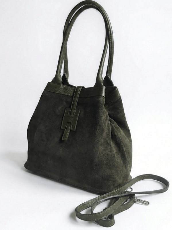 The large khaki handbag has been transformed into a more compact trapezoidal shape with an attached long handle.