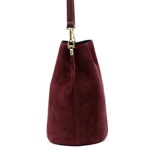 Profile of an elegant Italian bag made of genuine burgundy suede, manufactured in Florence.