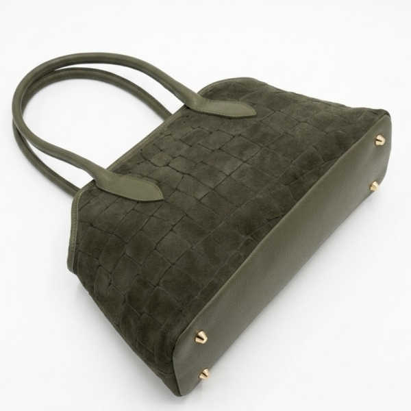 Smooth khaki leather bag bottom with gold-tone protective feet.