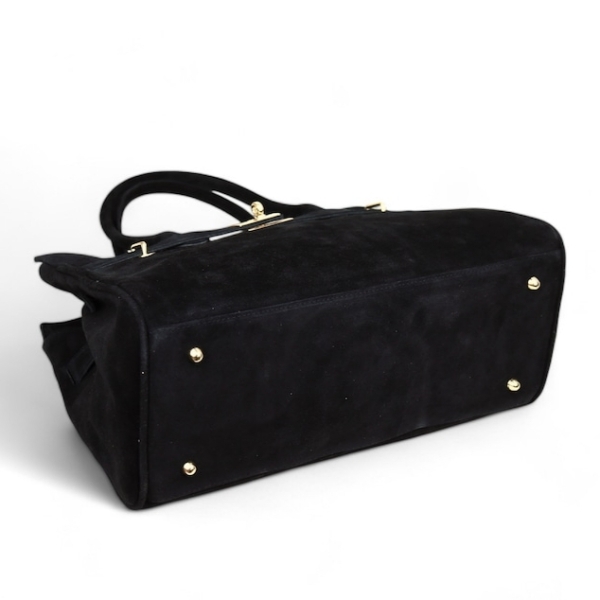 Bottom of a large black women's handbag, genuine suede, gold-tone metal protective feet.