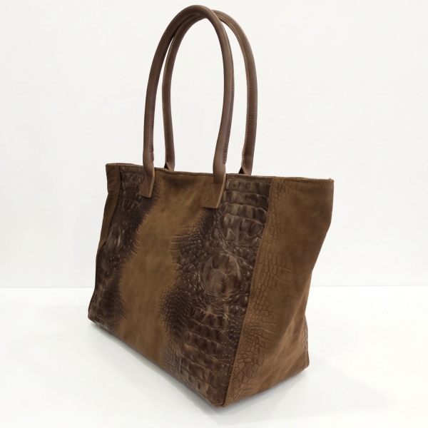 Profile of a large women's bag in a warm brown shade, featuring leather shoulder straps.