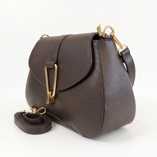 Dark brown women’s shoulder bag with a short handle and a stylish flap featuring a gold-tone metal clasp.