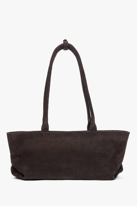 A view of the non-standard oblong shape of a brown suede bag